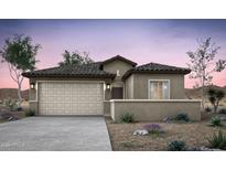 Charming single-story home featuring a stucco exterior, tile roof, and a two-car garage against a picturesque desert landscape at 42885 W Vincent Dr, Maricopa, AZ 85138
