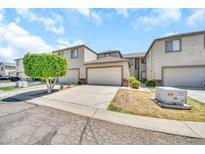 Well-maintained townhome featuring an attached two-car garage and drought tolerant landscaping at 4301 N 21St St # 3, Phoenix, AZ 85016
