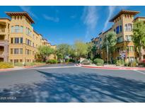 View of buildings and street in the Torrana community of Scottsdale, Arizona, on a sunny day at 5450 E Deer Valley Dr # 4199, Phoenix, AZ 85054