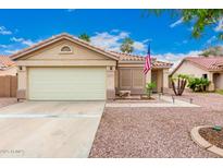 Charming single-story home with a well-manicured front yard and a two-car garage at 13359 W Post Dr, Surprise, AZ 85374