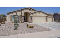 Charming single-story home featuring desert landscaping and a three-car garage at 1726 E Primera Dr, Casa Grande, AZ 85122