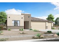 Charming single-story home with a neutral color palette, a three-car garage, and desert landscaping in the front yard at 18462 W Mohave St, Goodyear, AZ 85338