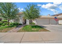Charming single-Gathering home featuring a manicured front yard and a two-car garage at 3440 E Topeka Dr, Phoenix, AZ 85050
