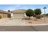 A charming single-Gathering home boasting a well-manicured front yard and a two-car garage at 35656 N Shorthorn Trl, San Tan Valley, AZ 85143