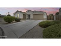 Beautiful single-Gathering home featuring a well-maintained yard and a spacious three-car garage at 35773 N Loemann Dr, San Tan Valley, AZ 85143