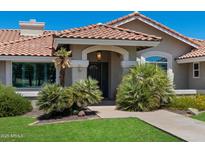 Charming front entrance with red tile roof, desert landscaping, and a cozy, welcoming atmosphere at 3822 E Florian Ave, Mesa, AZ 85206