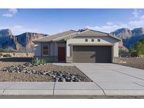 Charming single-story home with desert landscaping and mountain views, showcasing Southwestern living at 469 W Bunker Hill St, Florence, AZ 85132