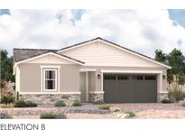 Charming single-story home featuring stone accents and a spacious two-car garage at 5353 W Manzanita Dr, Glendale, AZ 85302