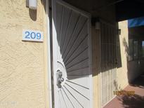 Apartment 209 shows a stylish security door entrance with a convenient electronic lock at 12221 W Bell Rd # 209, Surprise, AZ 85378
