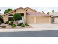 Charming single-story home with a well-maintained front yard and a two-car garage at 1894 E Sagebrush St, Gilbert, AZ 85296