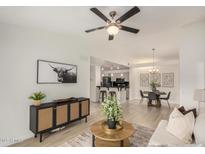 Bright living room featuring modern decor, stylish furniture, and an open layout to the kitchen at 2035 S Elm St # 211, Tempe, AZ 85282