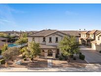 Two story home featuring a tile roof, landscaped yard with mature trees and covered porch at 2868 E Binner Dr, Chandler, AZ 85225