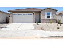 Charming single-story home features a two-car garage and neutral-toned exterior with rock landscaping at 37125 W Prado St, Maricopa, AZ 85138
