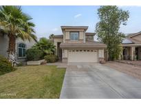 Well maintained two-story home with a two car garage and mature landscaping at 6858 W Potter Dr, Glendale, AZ 85308