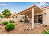 Covered patio featuring a table and chairs, perfect for outdoor dining and relaxation at 7101 W Beardsley Rd # 1403, Glendale, AZ 85308