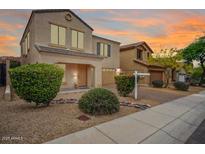 Charming two-story home with beautiful landscaping and a warm, inviting facade at 2323 W Hunter Ct, Phoenix, AZ 85085