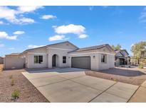 Beautiful single-story home featuring a well-maintained yard and a two-car garage at 2512 N Pony Ln, Casa Grande, AZ 85122