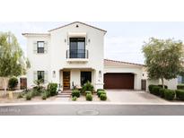 Elegant two-story home with a balcony, desert landscaping and a two car garage at 3927 E Sheila Ln, Phoenix, AZ 85018