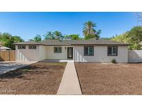 Charming single-story home with a manicured lawn and a welcoming entrance, showcasing its curb appeal at 510 W 14Th St, Tempe, AZ 85281