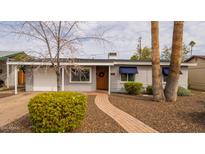 Charming single-story home with inviting curb appeal and well-maintained landscaping at 836 W Mitchell Dr, Phoenix, AZ 85013