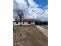 Charming single-story home featuring a covered carport and neutral-tone exterior paint at 138 E Monte Way, Phoenix, AZ 85042