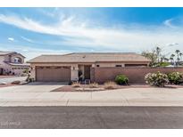 Charming single-story home with a desert-landscaped front yard and a two-car garage in a residential neighborhood at 16654 N 19Th Pl, Phoenix, AZ 85022