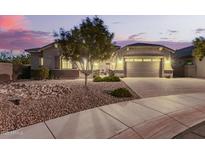 Charming single-story home featuring desert landscaping and a two-car garage, perfect for modern living at 20256 E Canary Ct, Queen Creek, AZ 85142