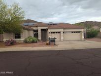 Attractive single-Gathering home with a three-car garage and desert landscaping at 20677 N 16Th Way, Phoenix, AZ 85024