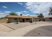 Charming single-story brick home with a well-maintained yard, desert landscaping, and a welcoming entrance at 2222 E Gretta Pl, Phoenix, AZ 85022