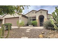 Charming single-story home with desert landscaping and a covered front entrance at 3002 W Caravaggio Ln, Phoenix, AZ 85086