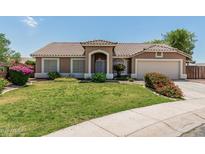 Charming single-story home featuring a well-maintained front yard and classic desert landscaping at 3059 E Tyson Ct, Gilbert, AZ 85295