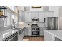 Well-appointed kitchen featuring stainless appliances, stylish countertops, and ample cabinet space for storage at 3521 N Barron --, Mesa, AZ 85207