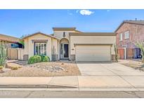 Charming single-story home with desert landscaping, a two-car garage, and a welcoming entryway at 3565 E Meadowview Dr, Gilbert, AZ 85298