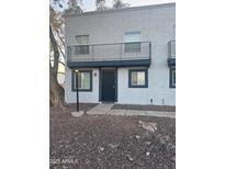 Inviting exterior of a two-story home with a balcony and private entrance at 4142 N 11Th St # 8, Phoenix, AZ 85014