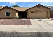 Charming single-story home featuring a two-car garage and low maintenance front yard landscaping at 4213 W Villa Linda Dr, Glendale, AZ 85310
