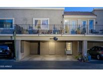 Charming two-story condo with a covered parking area and upper-level balcony perfect for outdoor seating and relaxation at 4431 N 21St Pl, Phoenix, AZ 85016