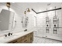 This bathroom features a double vanity and a large shower with dual shower heads at 4512 W Rushmore Dr, Anthem, AZ 85087