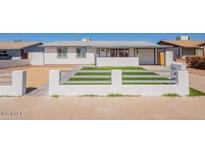 Charming single-story home featuring a well-maintained front yard and inviting curb appeal at 8802 W Monterey Way, Phoenix, AZ 85037