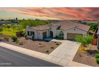 Stunning home featuring desert landscaping, tile roof, multiple garages, and a beautiful entryway at 9157 W Country Club Trl, Peoria, AZ 85383