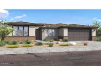 Charming single-story home features desert landscaping, neutral color palette and large windows at 1245 W Via Las Brisas Ln, San Tan Valley, AZ 85140
