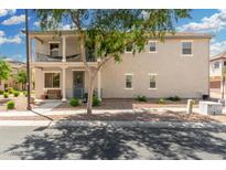 Inviting two-story home with charming balcony and well-maintained front yard landscaping at 1689 E Elgin St, Gilbert, AZ 85295