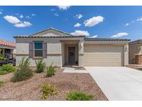Charming single-story home featuring desert landscaping and a two-car garage at 18492 E Donato Dr, Gold Canyon, AZ 85118