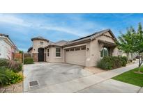 Charming single-story home featuring a stucco exterior, well-manicured landscaping, and a two-car garage at 2822 E Hidalgo Ave, Phoenix, AZ 85040