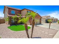 Charming two-story brick home with manicured lawn and desert landscaping at 2909 W Bowker St, Phoenix, AZ 85041