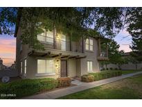 Charming two-story townhome featuring dual balconies and well-maintained landscaping at 3687 E Leslie Dr, Gilbert, AZ 85296