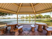 Picturesque gazebo overlooking a serene lake, perfect for relaxation and enjoying scenic views at 10330 W Thunderbird W Blvd # B103, Sun City, AZ 85351