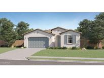 Charming single-story home with stucco siding, tile roof, two car garage, and desert landscaping at 16722 W Audrey Ln, Surprise, AZ 85387