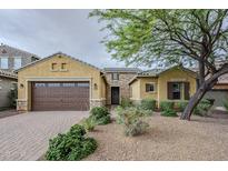 Charming single-Gathering home with a low maintenance front yard and a tandem three car garage at 2525 W Balao Dr, Phoenix, AZ 85085
