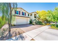 Charming two-story home boasts a two-car garage, landscaped yard, and inviting curb appeal at 4836 S Covalent Ln, Mesa, AZ 85212