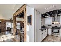 Bright kitchen features stainless steel appliances, white cabinetry, and dark countertops at 5621 N 79Th St, Scottsdale, AZ 85250
